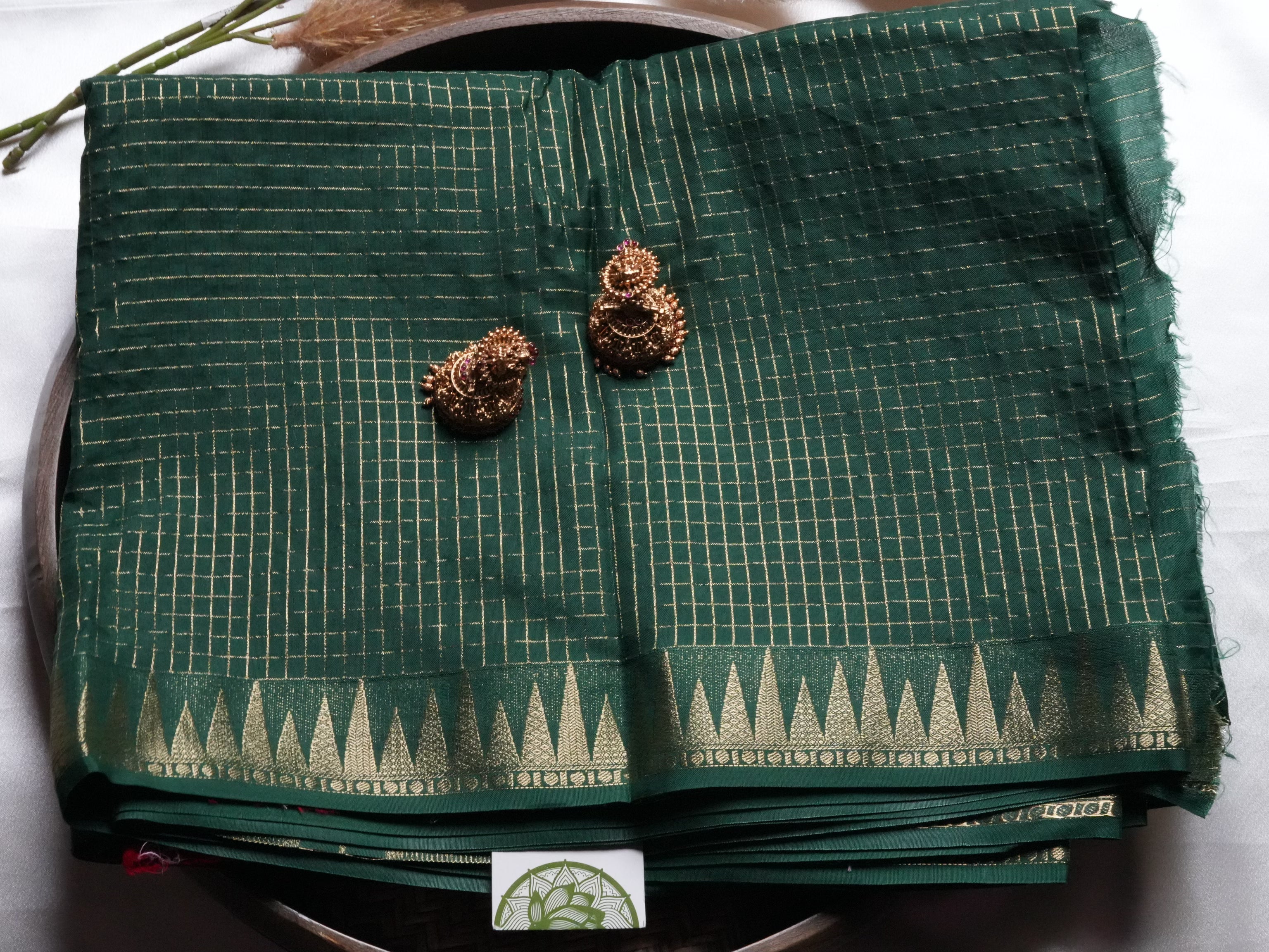 Festive Bottle Green Mysore Crepe Semi Silk Saree with contrasting red blouse