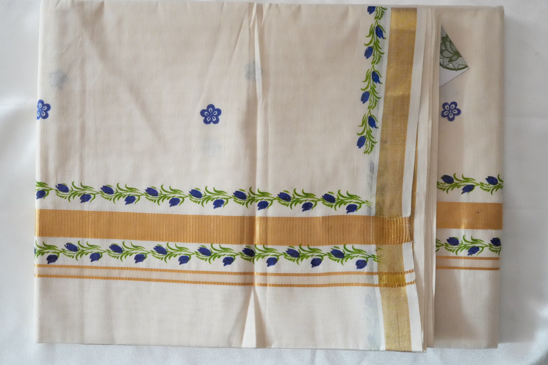 Artistically Hand-Painted Traditional Kerala Saree with Blue Floral Vine & Gold Accents