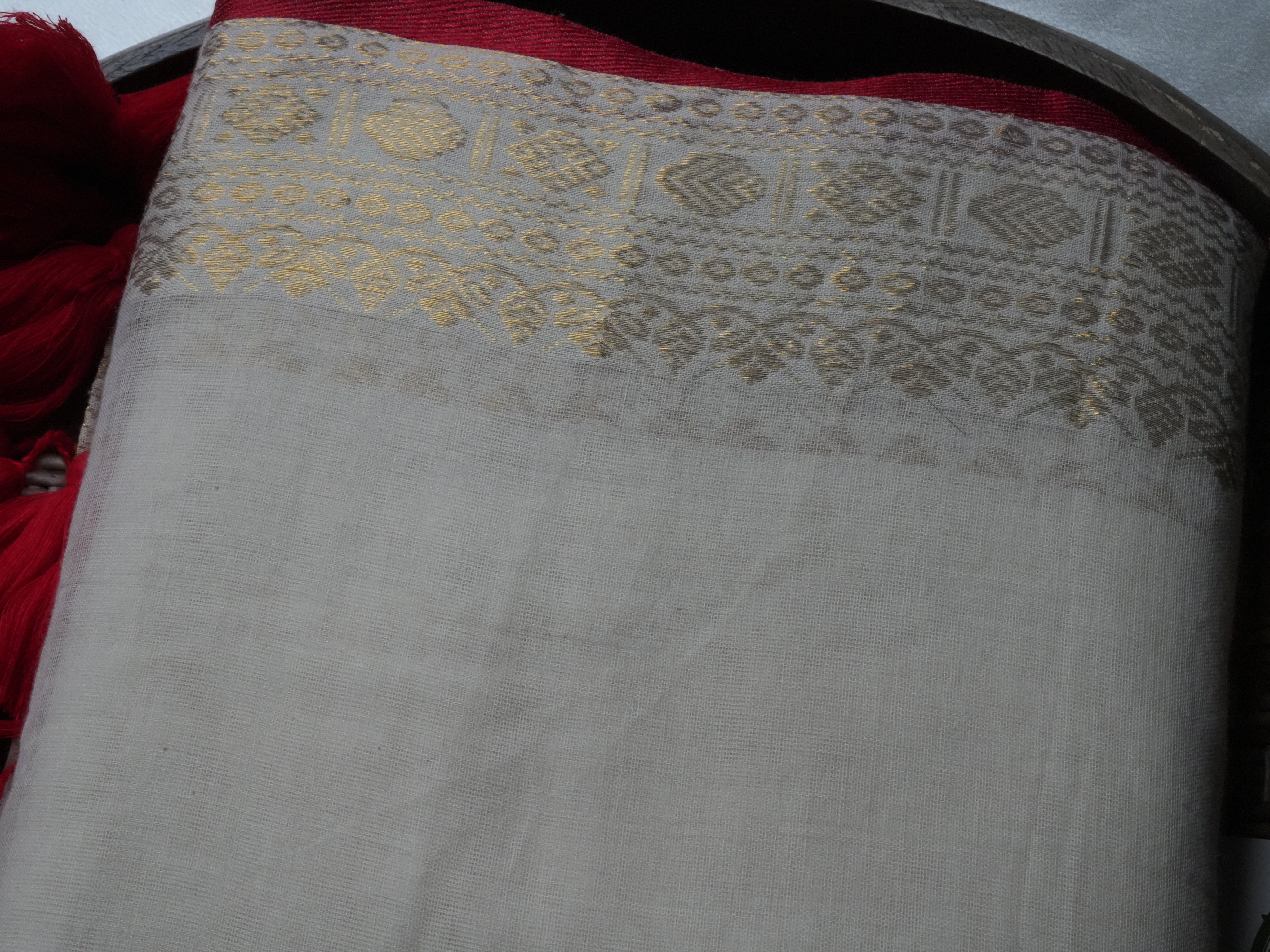 Elegant Ivory Mul Cotton Saree with Crimson Tassels