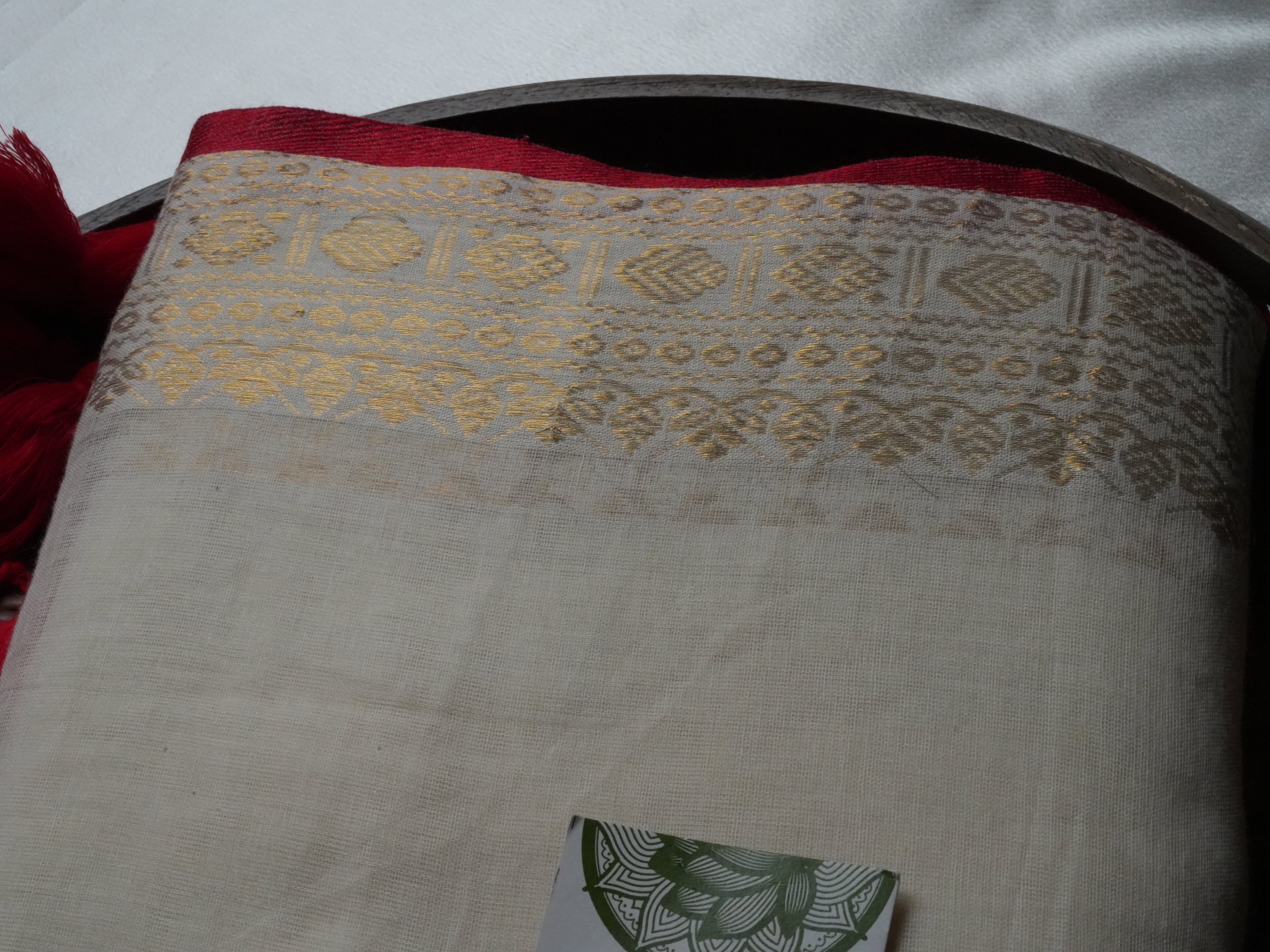 Elegant Ivory Mul Cotton Saree with Crimson Tassels