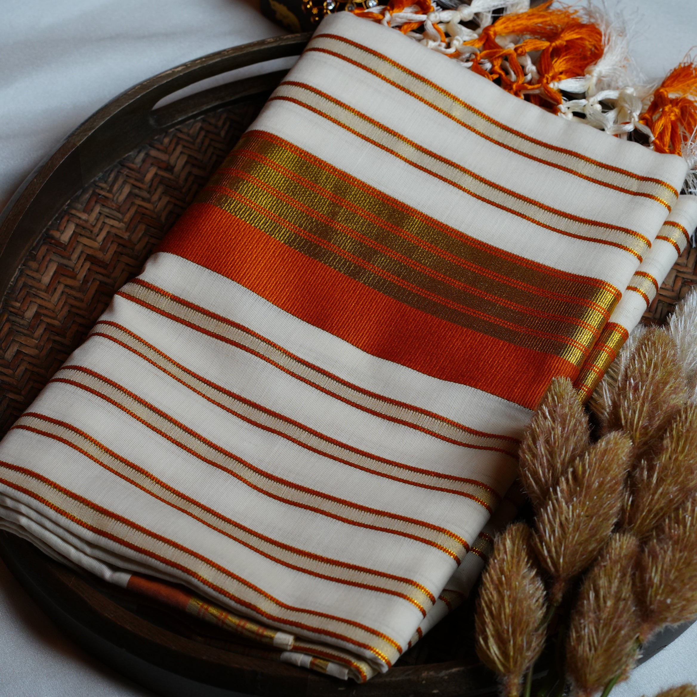🍊 Festive Orange & Shimmering Gold Kerala Saree with Handcrafted Tassels ☀️