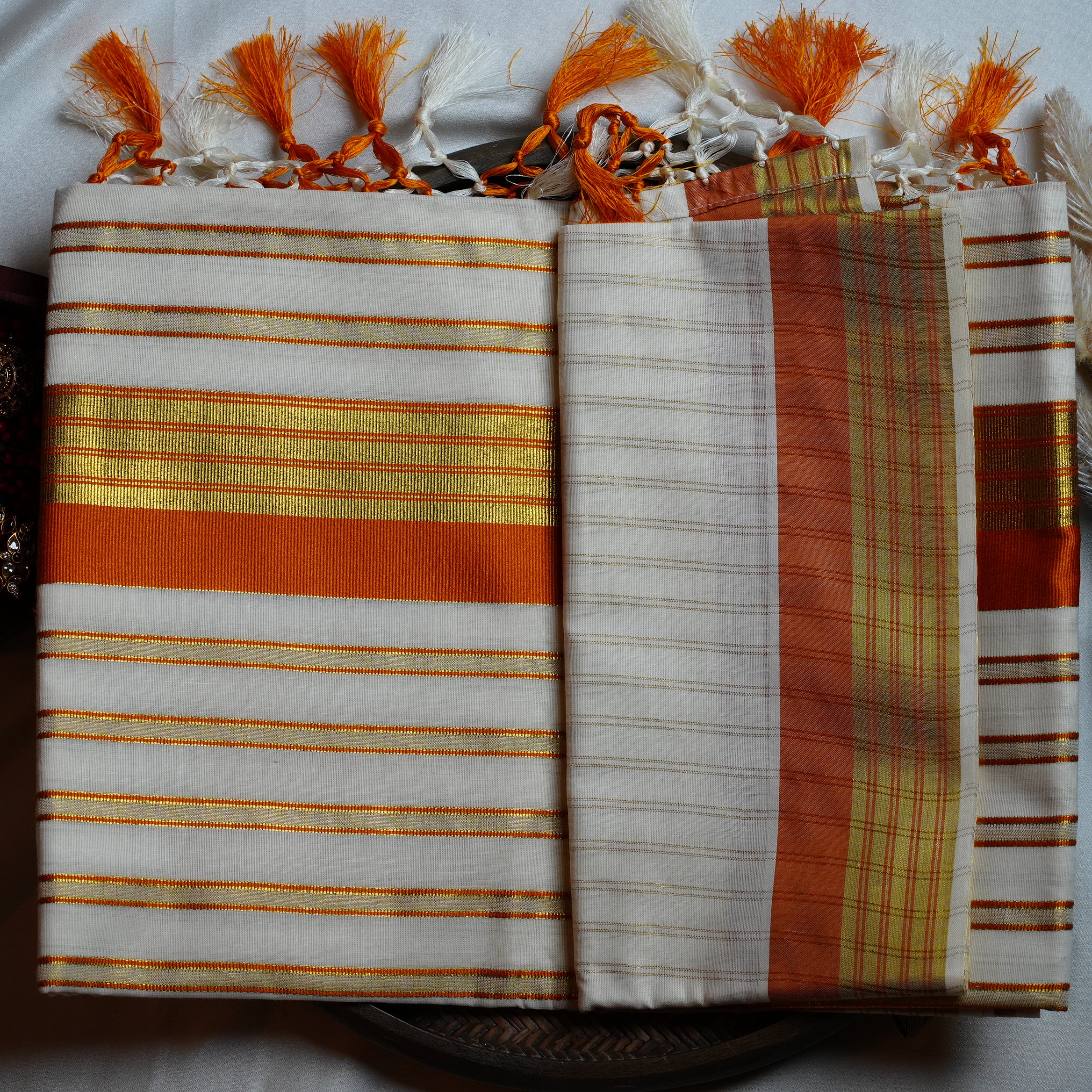 🍊 Festive Orange & Shimmering Gold Kerala Saree with Handcrafted Tassels ☀️