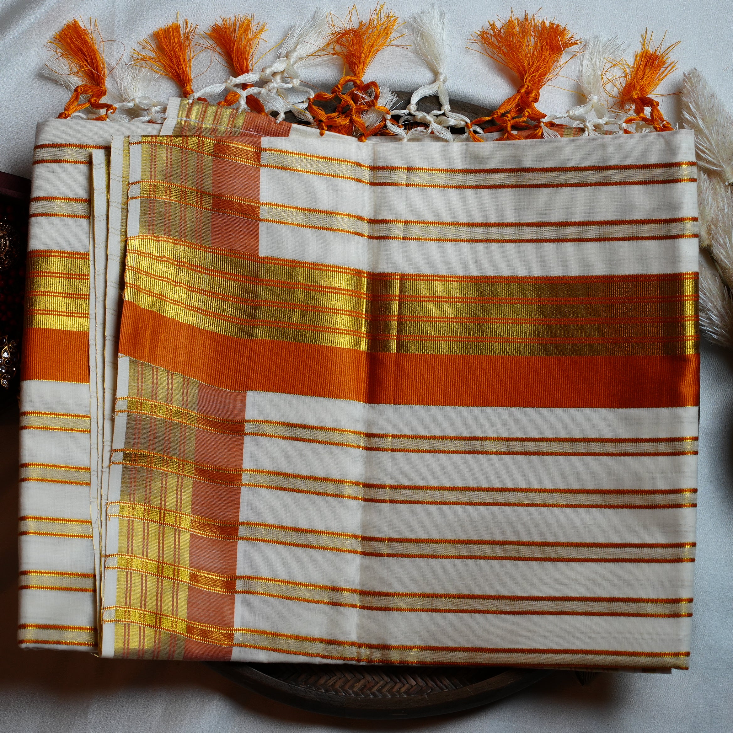 🍊 Festive Orange & Shimmering Gold Kerala Saree with Handcrafted Tassels ☀️