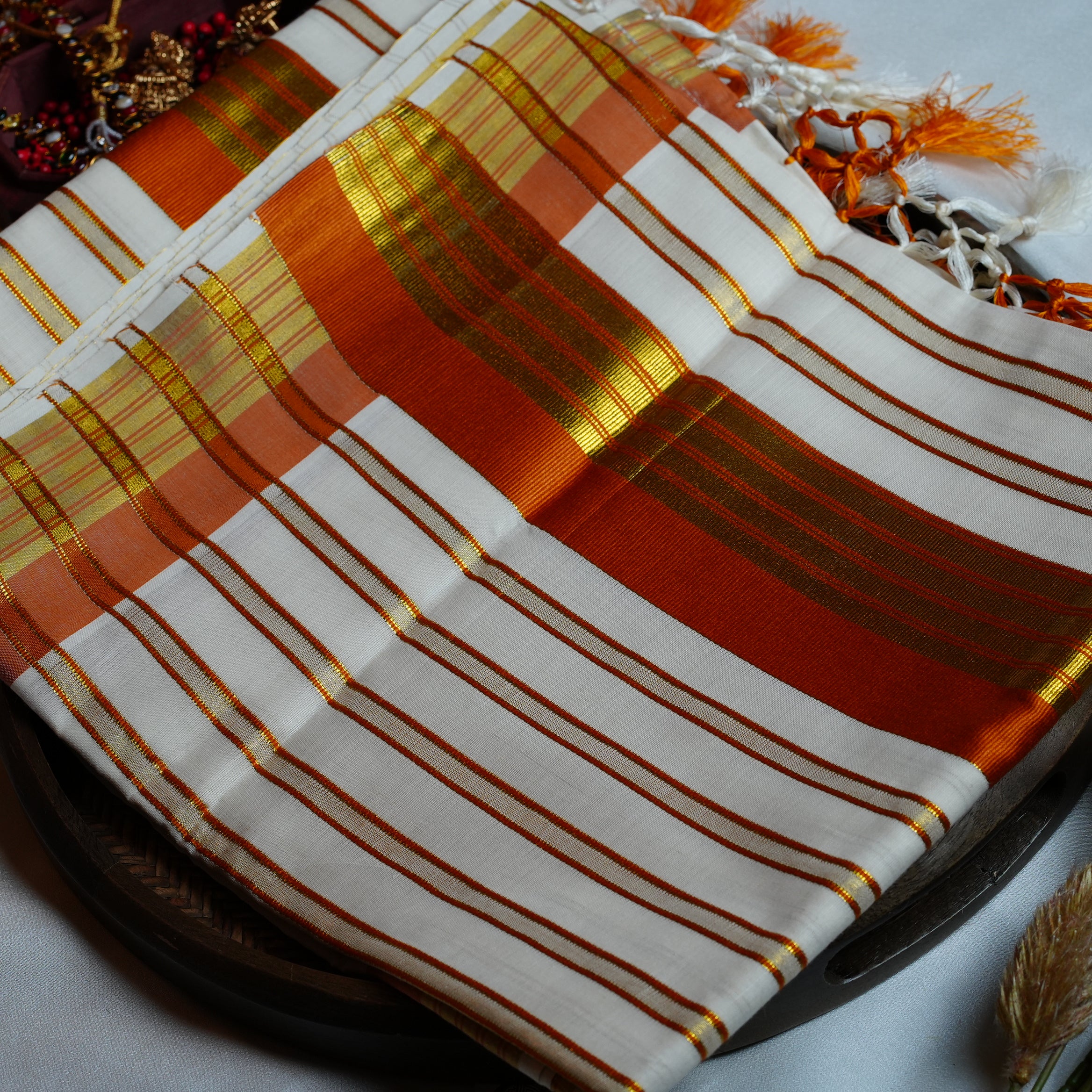 🍊 Festive Orange & Shimmering Gold Kerala Saree with Handcrafted Tassels ☀️