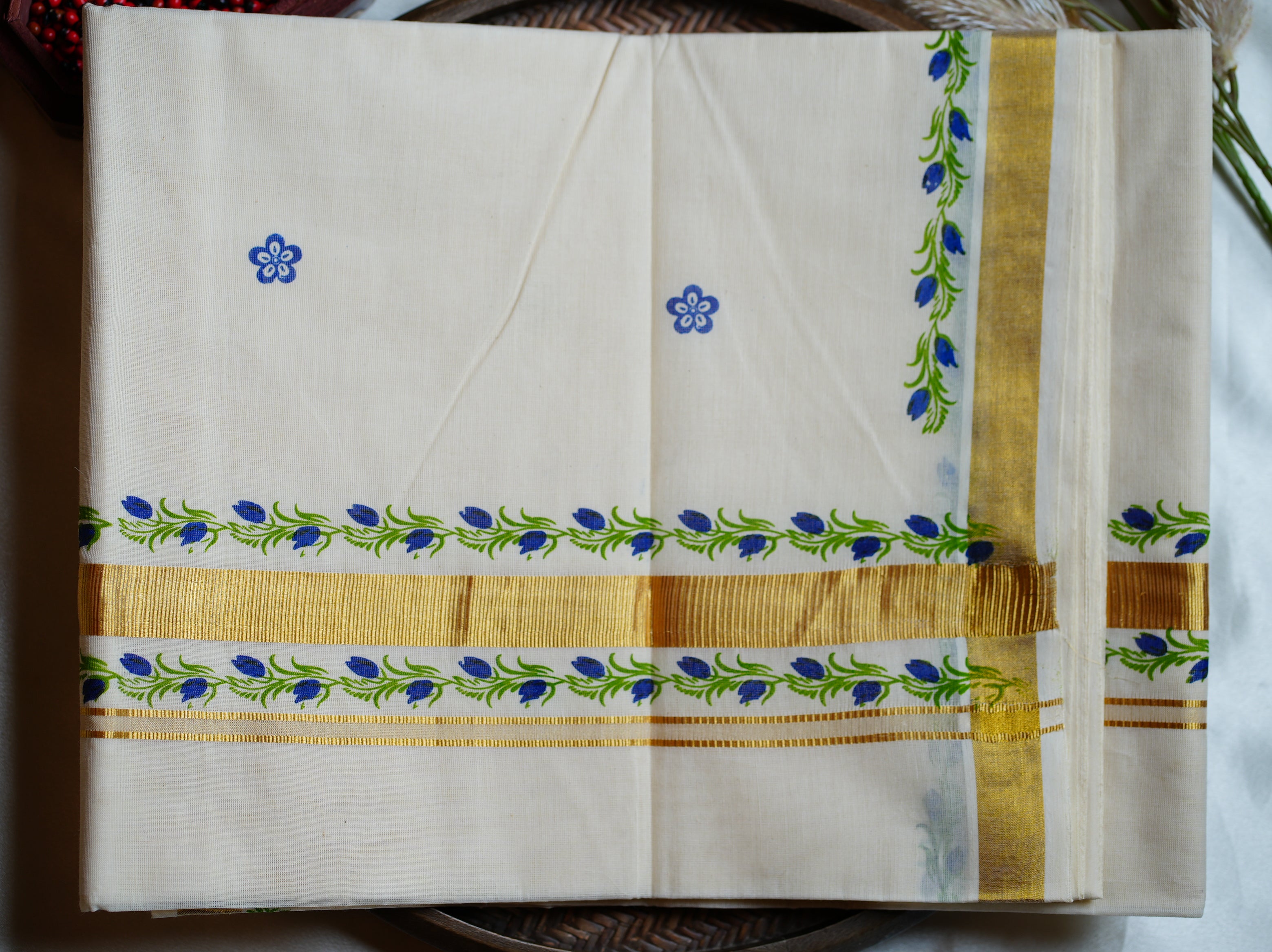 Artistically Hand-Painted Traditional Kerala Saree with Blue Floral Vine & Gold Accents