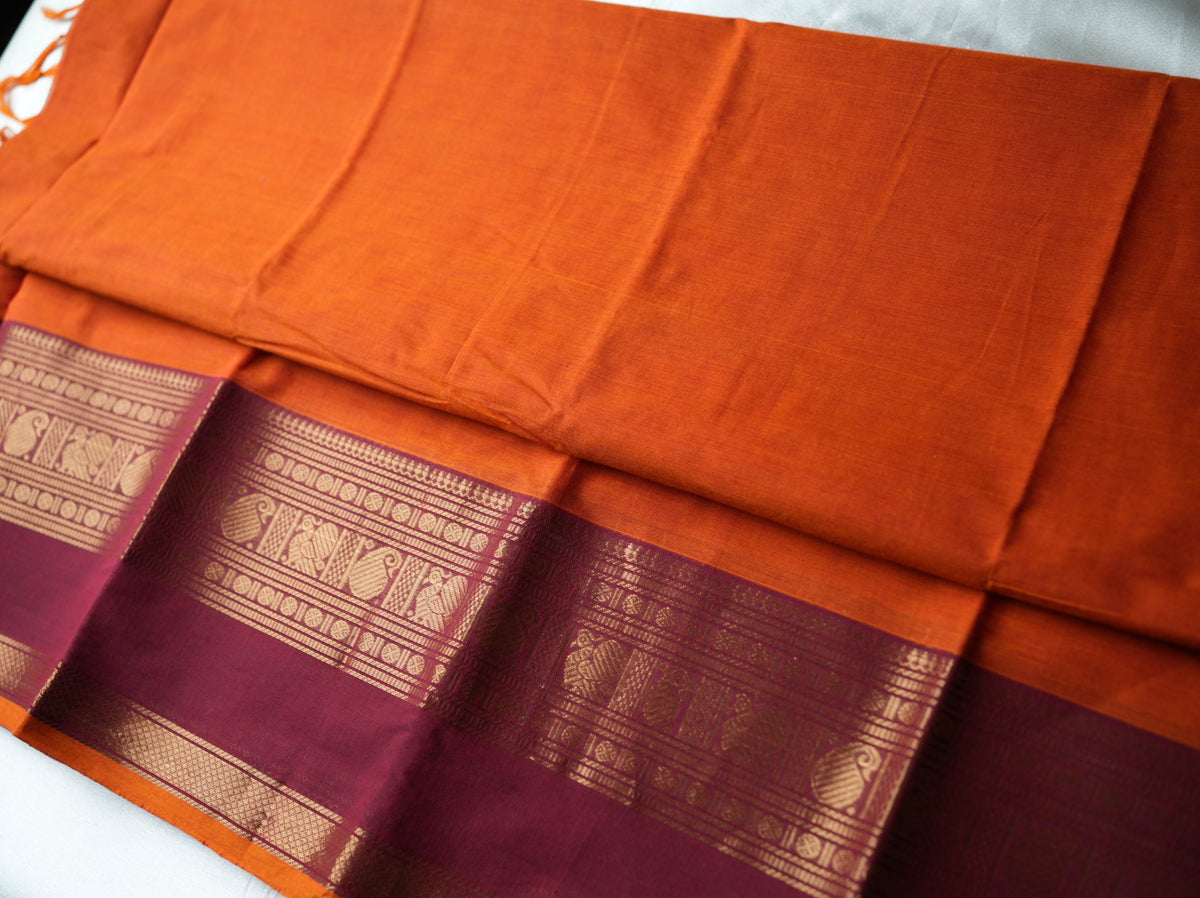 🍊 Bright Orange Pure Kanchi Cotton Saree with Maroon Zari Border & Striped Pallu ✨🥻 - SAROYA