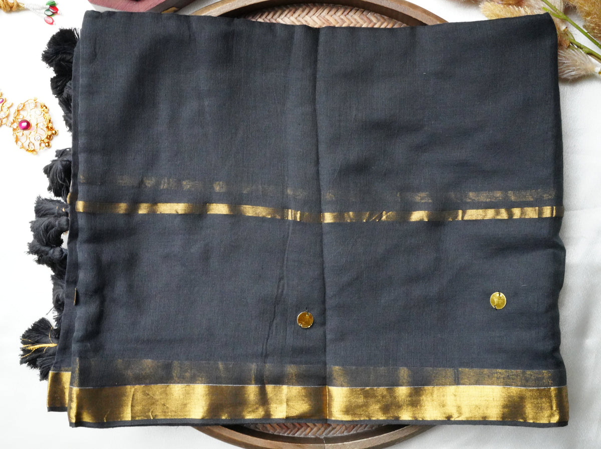 🖤 Jet Black Pure Mul Cotton Saree with Golden Zari Border & Playful Tassels ✨🥻 - SAROYA