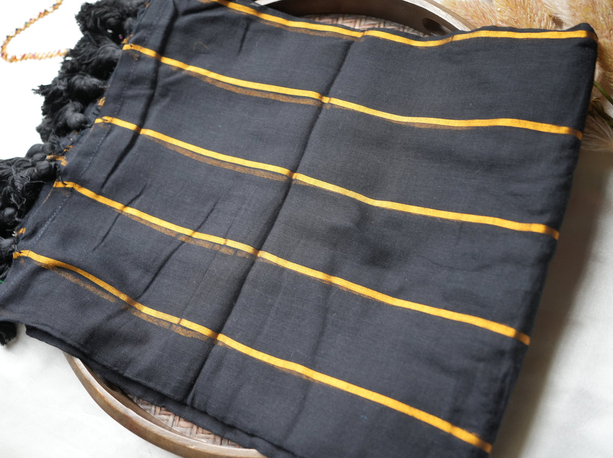 🖤 Midnight Black Pure Mul Cotton Saree with Golden Zari Stripes & Statement Tassels ✨🪙 - SAROYA